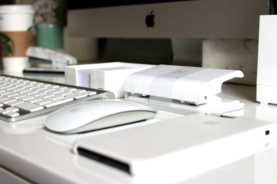 Desk with documents, charts and a laptop for data analysis