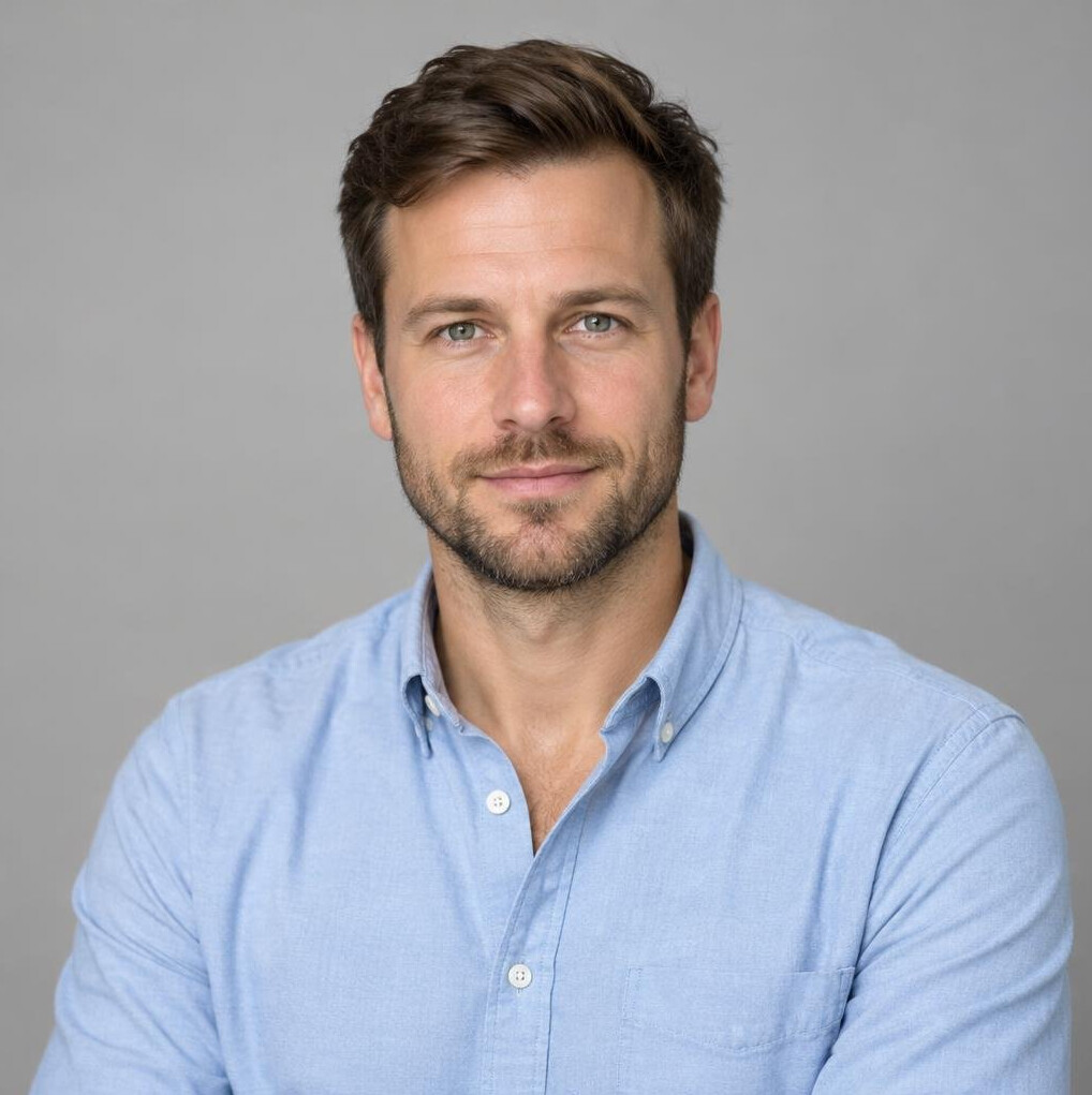 Studio portrait of a bearded man in a casual shirt